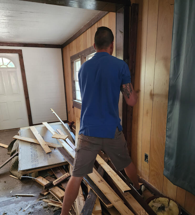 Removing the paneling trims from interior of house